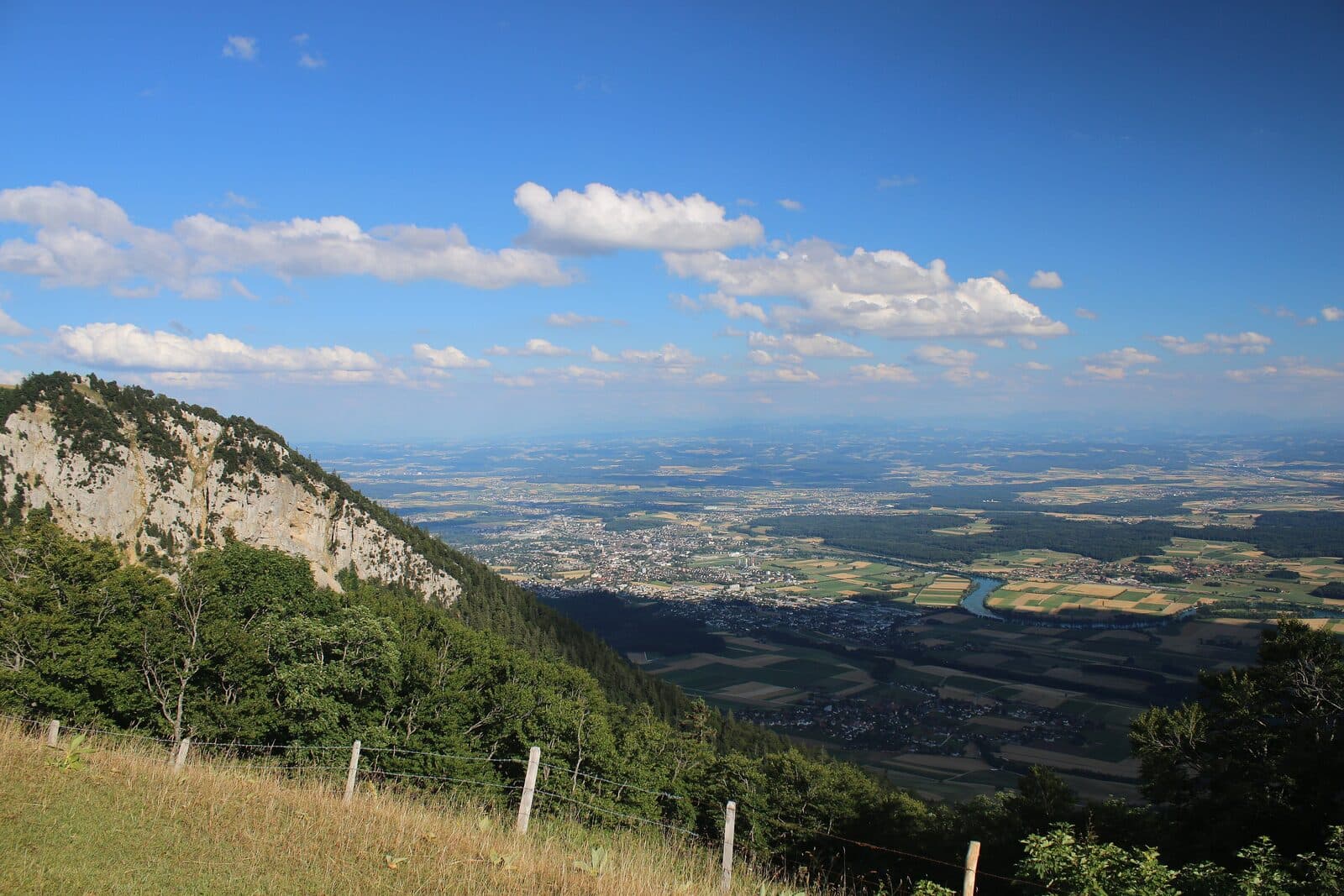 A Jura cliff above the wide Aare plain near Grenchen